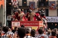 10527032-6766863-A_festival_in_Italy_where_people_throw_oranges_at_each_other_has-a-67_1551649148471