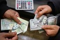 خدادادی: دولت ساماندهی بازار ارز را با جمع‌آوری دلالان چهارراه استانبول و میدان فردوسی پیش ببرد